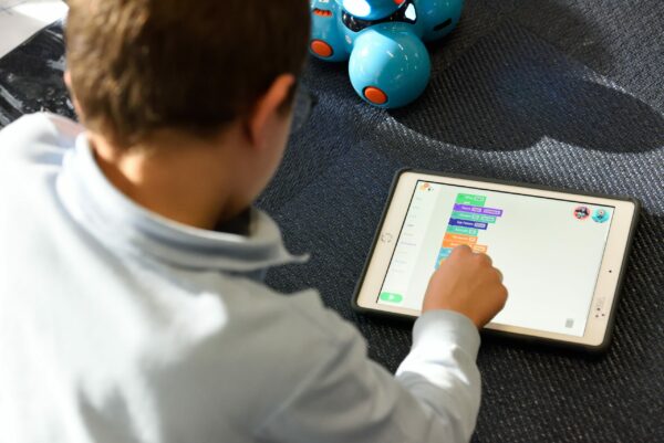 boy coding on tablet