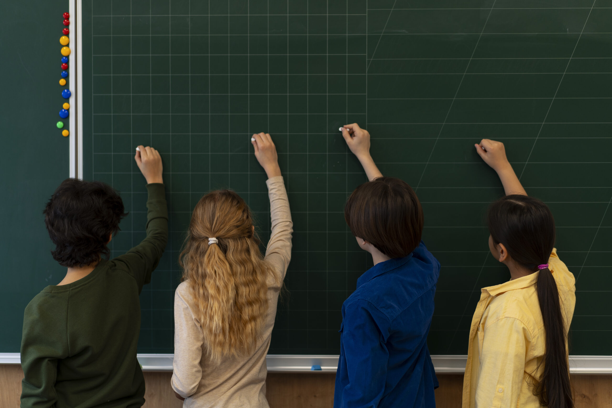 back-view-kids-writing-board